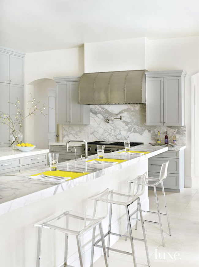 Segreto Secrets - Modern Meets French Country - Marble Kitchen with Metal Range Hood