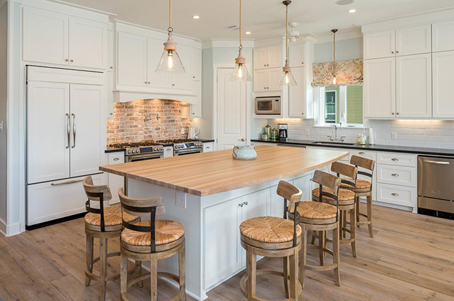 Segreto Secrets - Galveston Beach House - Wood Island and Brick Backsplash in White Kitchen