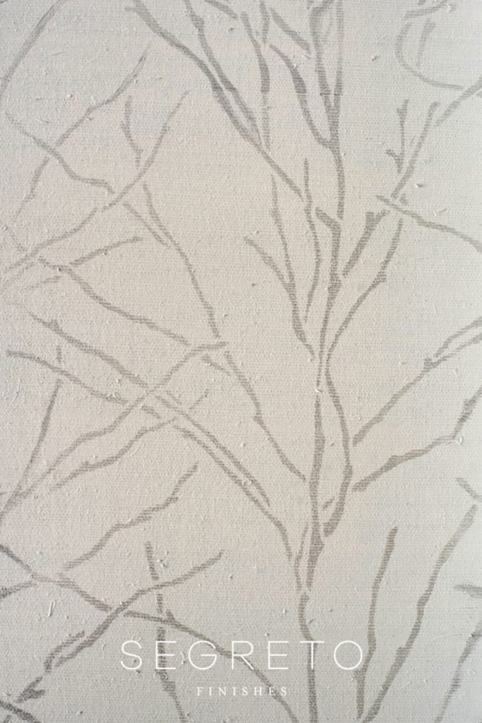 tree branch stencil design over wallcovering