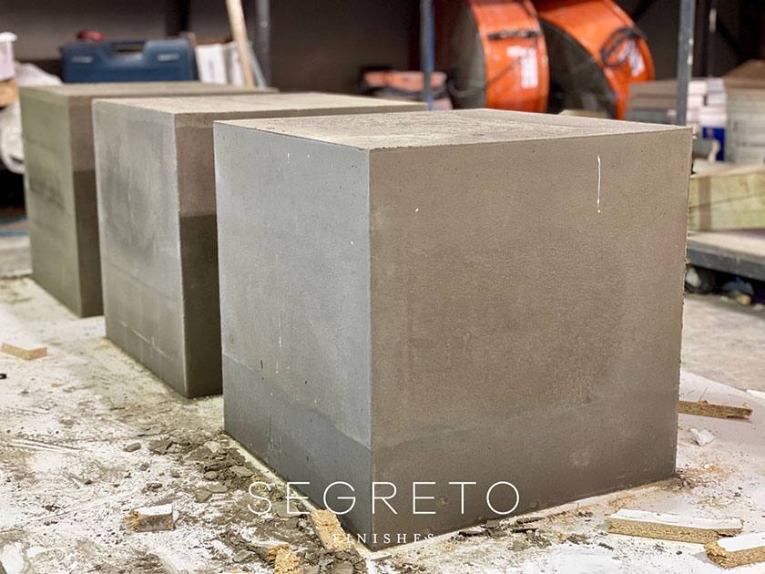 concrete cubes pured as bases for SegretoStone side tables