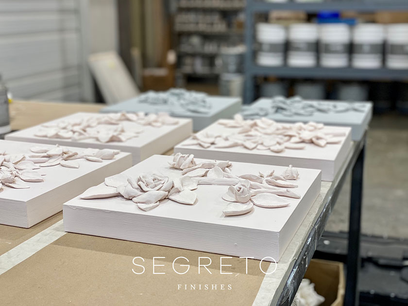 several clay mold floral art pieces