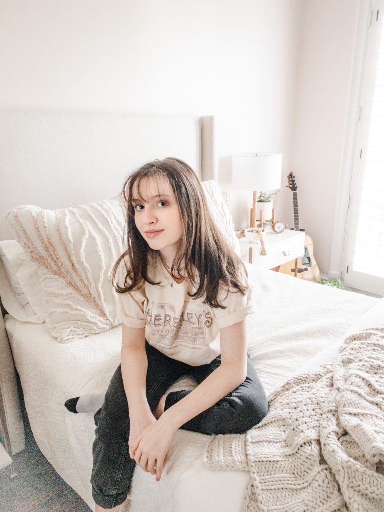 Girl sitting on bed Boho Chic Bedroom, girl sitting on bed, distance learning space