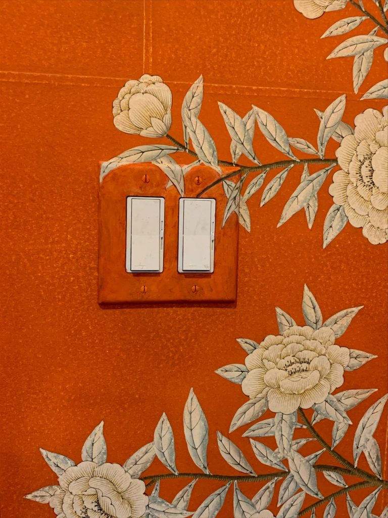 Plates to blend with wallpaper