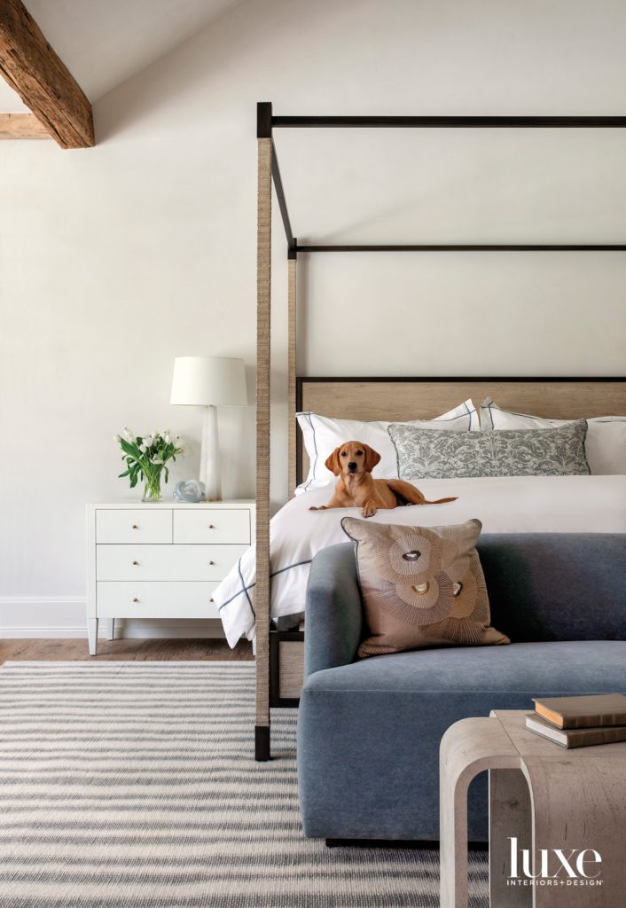 A Robert James Collection Majorca bed, Made Goods chest from Ladco and Suzanne Kasler lamp from M&M Lighting mingle in the main bedroom. The Holland & Sherry velvet-clad sofa holds a Kelly Wearstler for Kravet embroidered silk pillow opposite a coffee table from Area. The rug is Merida.