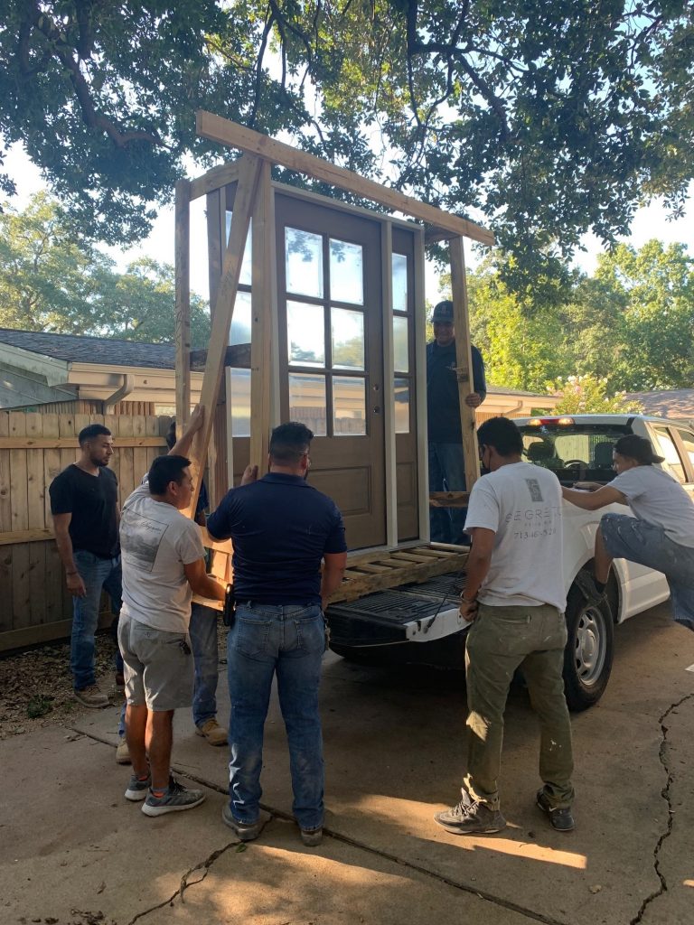 Crew delivering exterior door