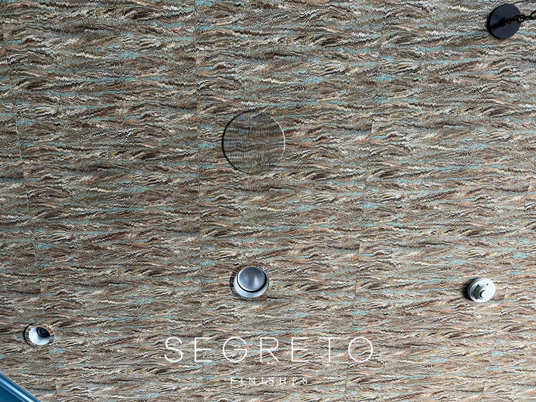 Speakers and cans painted to blend with wallcovering