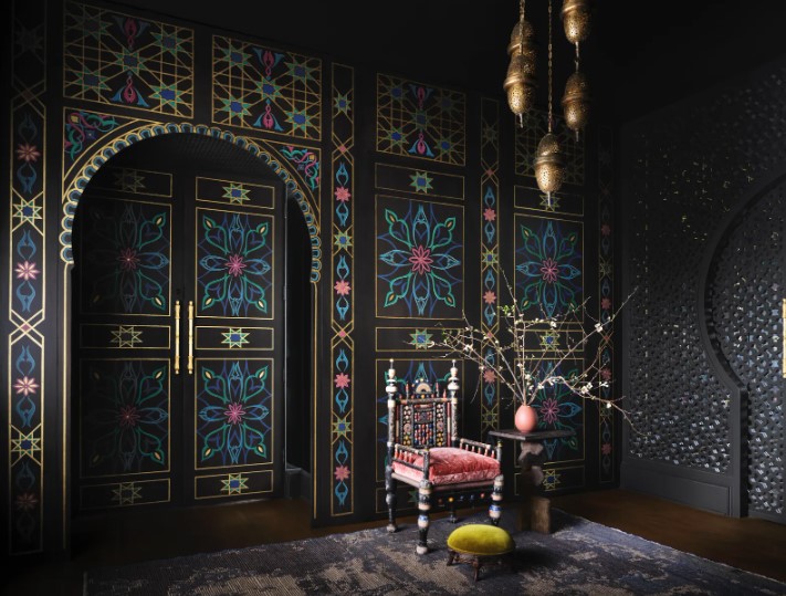 Hand-painted doors by Segreto finishes, a custom chandelier with hand-cut brass pendants by The Arabic Bazaar and an antique Punjabi chair and footstool set the tone for this palatial home with a Moroccan soul.